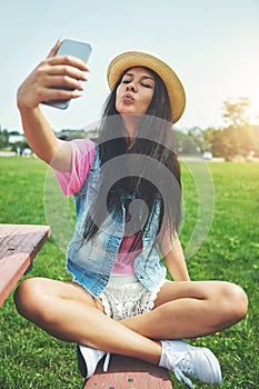 Smile, girl and selfie on bench in park for profile picture on social media or memory of summer vacation in California