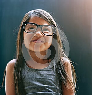 Smile, glasses and girl in studio with eye care for optometry, prescription and happiness. Youth, kid and frame of