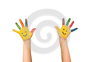 Smile, happiness and fun concept. Happy kid shows painted hands