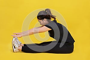 Smile happy Beautiful portrait young Asian woman stretching exercise workout on yellow background, fitness sport girl aerobic and