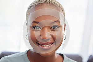 Smile, happy and portrait of a black woman in a house to relax, rest and calm. Beautiful, attractive and face of a