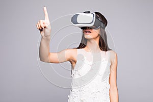 Smile happy woman getting experience using VR-headset glasses of virtual reality at home much gesticulating hands