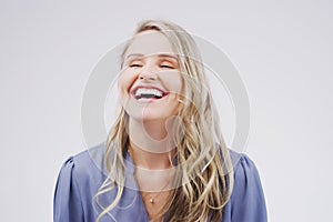 Smile, happy and woman with laughing in studio for funny joke, playful comic and positive humour. Female person photo