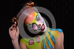 Smile lady with a face painting clown