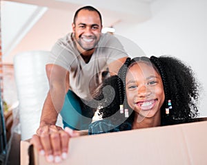 Smile, man and child playing in box at new house, apartment or property for moving, relocating and purchase a home photo