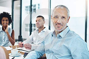 Smile, meeting and portrait of mature businessman in office with coffee and documents for financial planning. Discussion