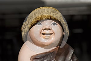 Smile monk statue