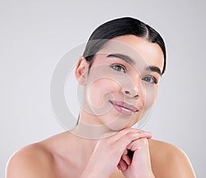 Smile, portrait and girl in studio for skincare with glowing, smooth and clear face. Female model, soft and natural skin