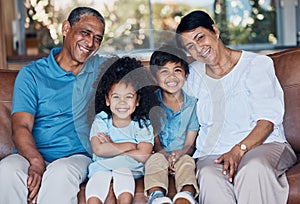 Smile, portrait and grandparents with children on sofa for happy, bonding and peace on holiday. Love, care and happiness