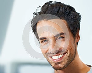 Smile, portrait and happy man at home with positive attitude, energy or mindset. Joy, face or handsome male person in a