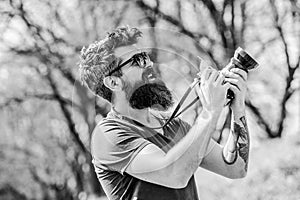 Smile. retro photographic equipment. brutal photographer with camera. photo of nature. reporter or journalist. hipster
