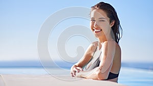 The smile only summer could give. a woman enjoying a swim.