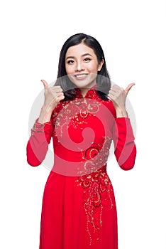 Smile Vietnamese woman in dress traditional Ao Dai and introduce