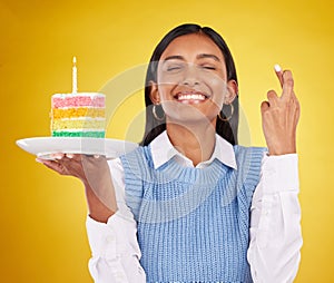 Smile, wish and woman with cake in studio for happy celebration or party on yellow background. Happiness, excited gen z