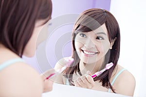 Smile woman brush teeth