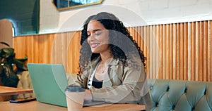 Smile of woman in cafe, typing on laptop and remote work, reading email or writing blog, article or research on internet