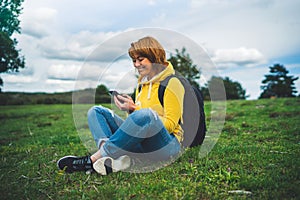Smile woman holding in female hands gadget technology, tourist young girl text message on background green grass using mobile