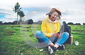 Smile woman holding in female hands gadget technology, tourist young girl text message on background green grass using mobile