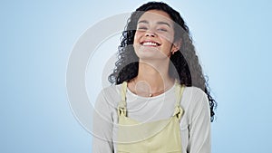 Smile, woman and laughing in studio, face with positive attitude and funny on blue background. Comic, young gen z model