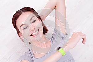 Smile woman look smart watch