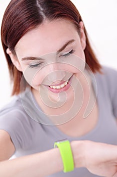 Smile woman look smart watch