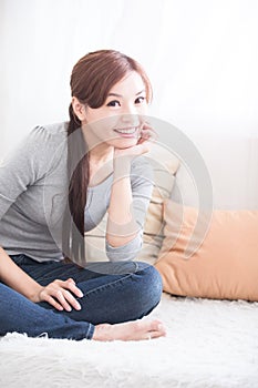 Smile woman sit on sofa