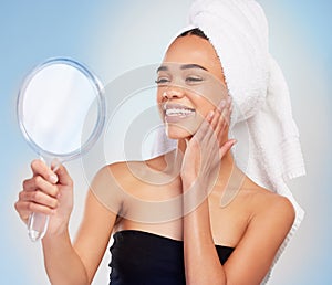 Smile, woman and skincare for beauty in mirror, spa and routine for cosmetics, wellness in blue background. Female