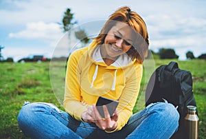 Smile women holding in female hands gadget technology, tourist young girl on background green grass using mobile smartphone, hiker