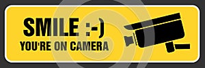 Smile you`re on camera sign