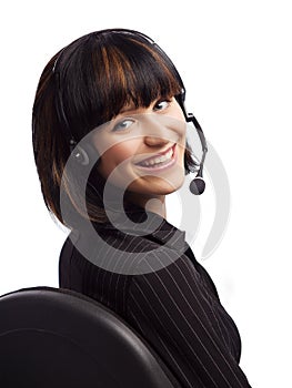 Smiled brunette woman in chair with headphone