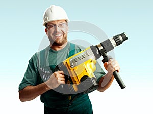 Smiled workman in helmet hold perforator