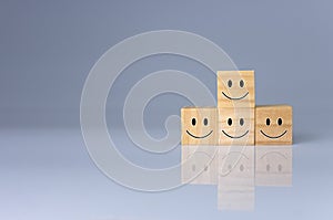 Smiles on the cube. It represents positive ratings, feedback and customer reviews. Satisfaction Concept, Satisfaction Survey,
