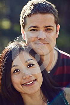 Smiles inspired by love. Portrait of a happy young couple spending time together outdoors.