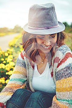 Smiles only spring can bring. an attractive young woman enjoying a spring day outdoors.