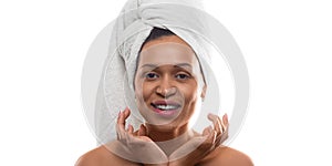 Smiley 35 years old african-american woman after shower with terry towel on head - isolated on white background. Format