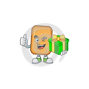 Smiley biscuit cartoon character holding a gift box