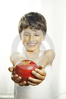 Smiley boy with red apple