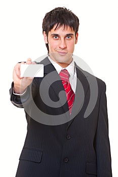 Smiley businessman showing business card