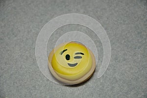 A smiley emoji biscuit