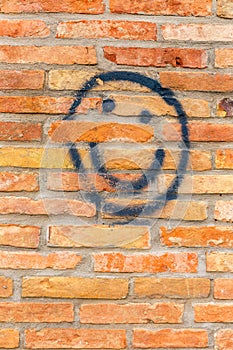 Smiley face drawn on a wall