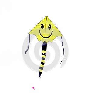 Smiley Face Kite Flying in a Cloudy Skiy