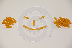 Smiley face made out of pennette pasta