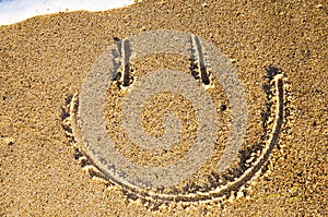 Smiley face in the sand