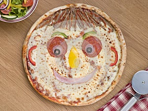 Smiley Faced Pizza with a Side Salad