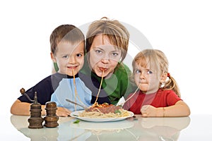 Smiley family eating pasta