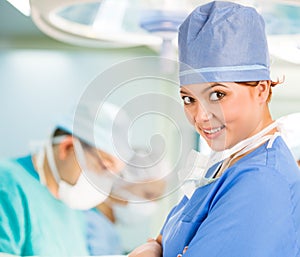 Smiley female doctor in operation room