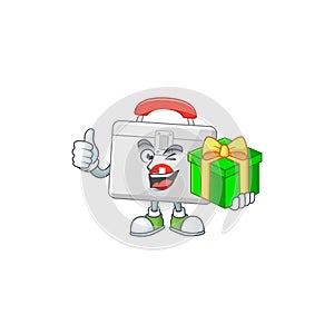 Smiley first aid kit cartoon character holding a gift box