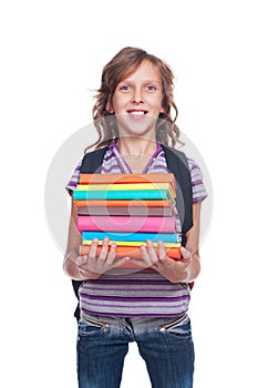Smiley little student holding some books