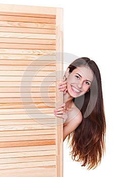 Smiley woman concealed by fitting screen