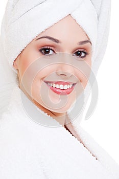Smiley woman in white bathrobe